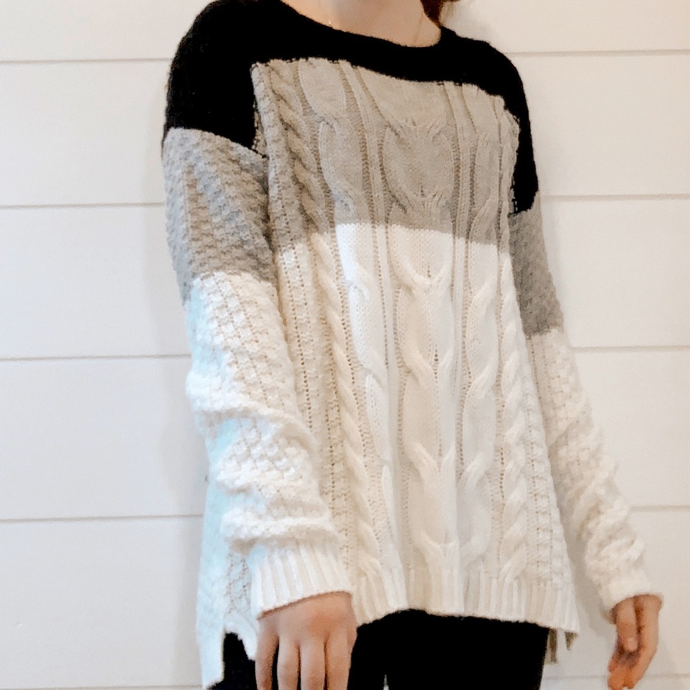 black, white, and grey striped sweater